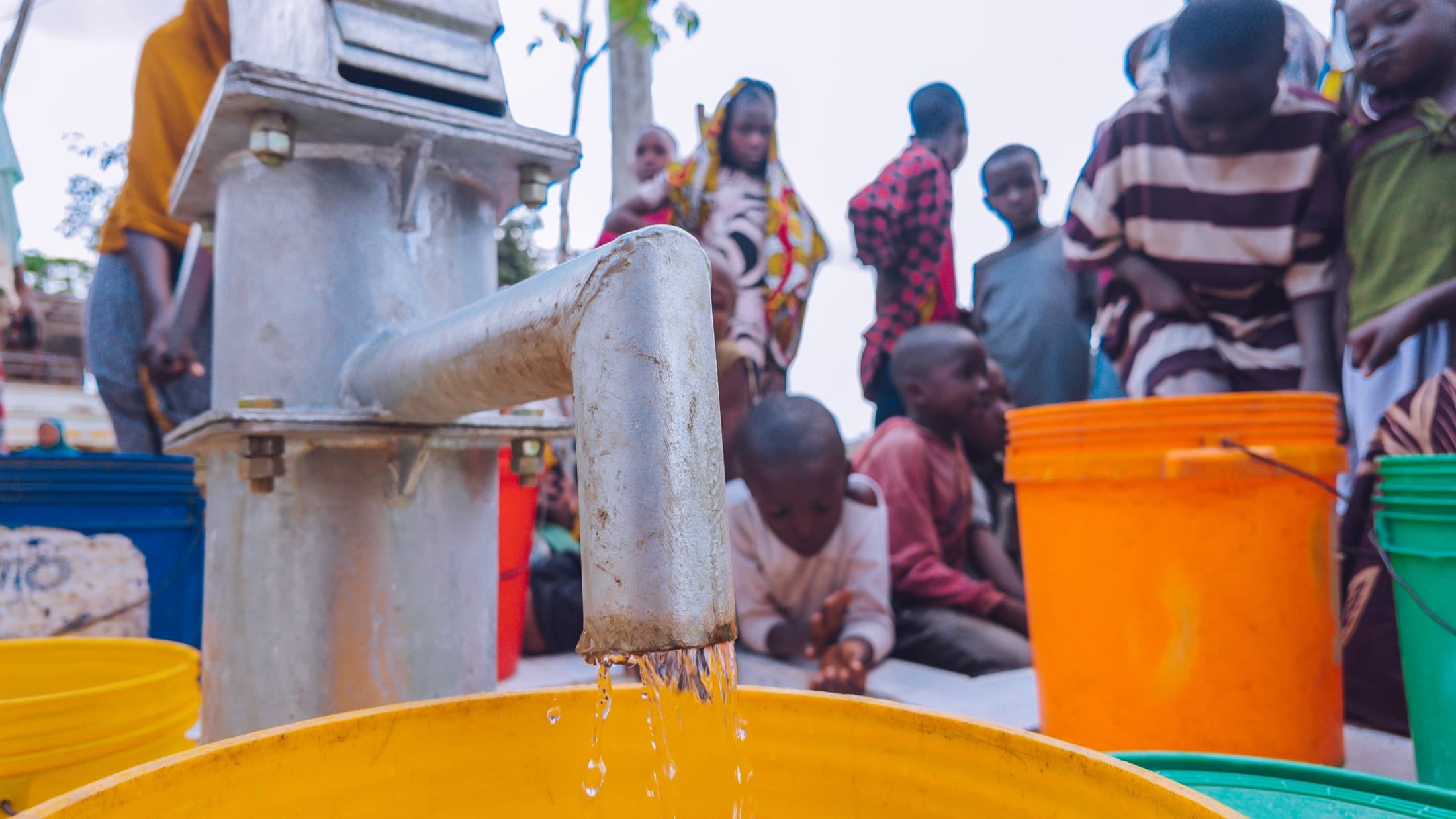 Community members gathered around a working water point