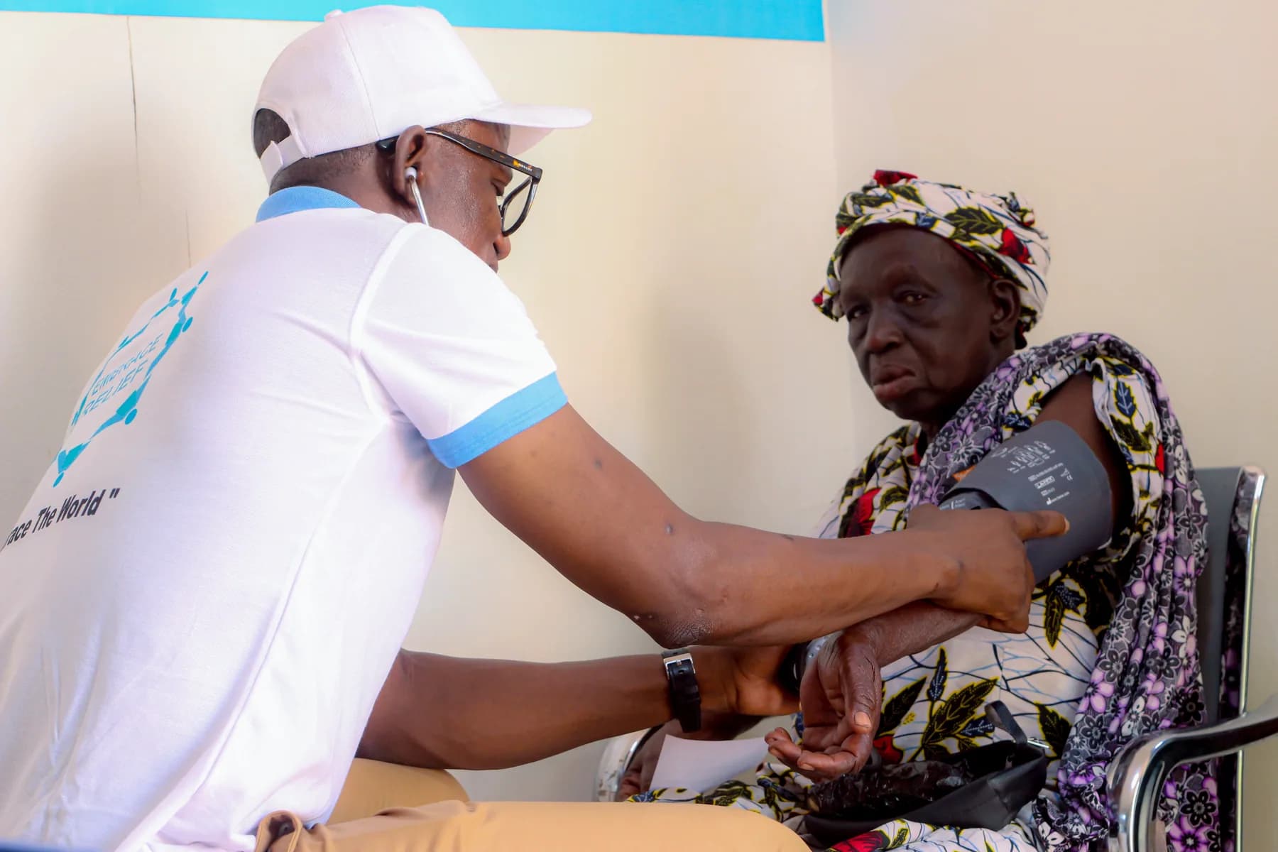 A clinician checking a patient during eye-care outreach