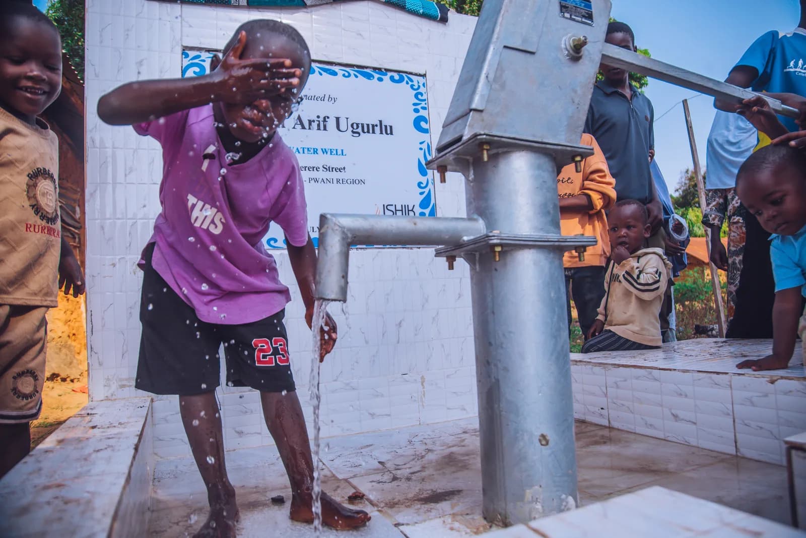 A community using an Embrace Relief water well