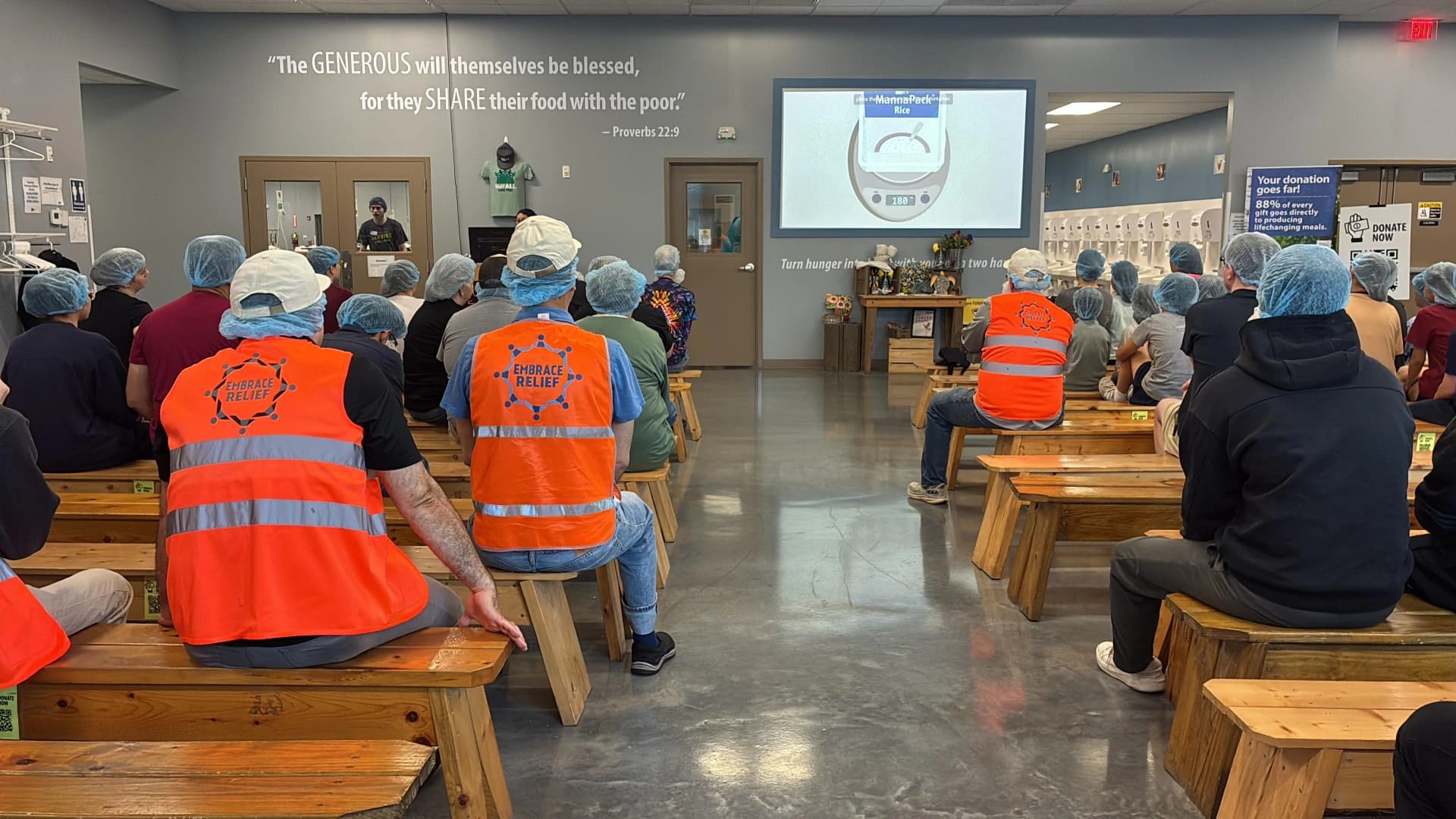 Embrace Relief volunteers preparing for a food-packing event