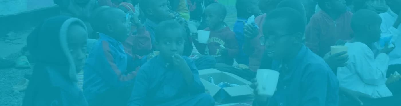 Children sharing food during a community celebration