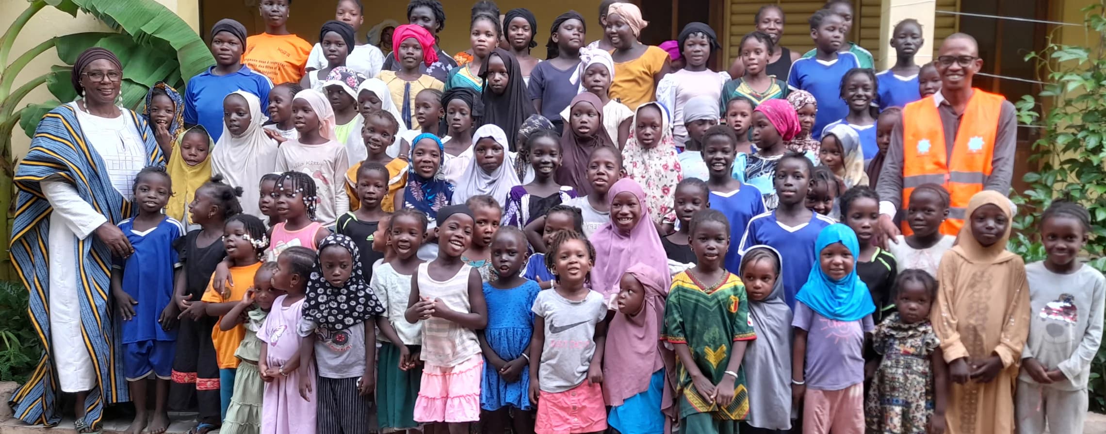 Girls and caregivers gathered at Djiguiya Bon Orphanage in Bamako, Mali