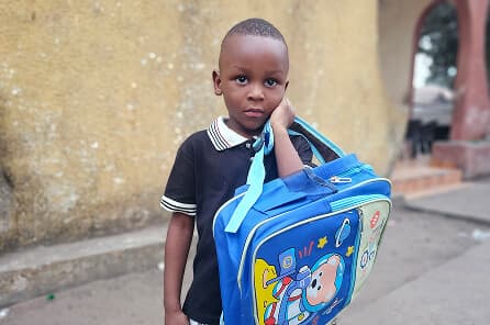 Child carrying a school bag