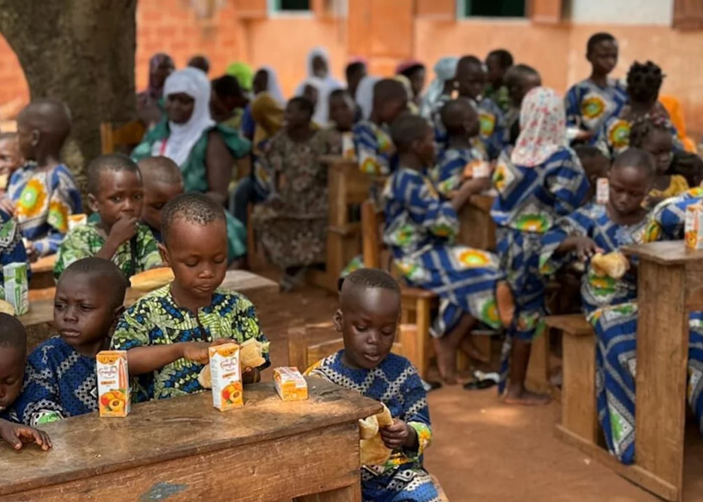 Children sharing a meal at Vikponagninou Orphanage in Benin