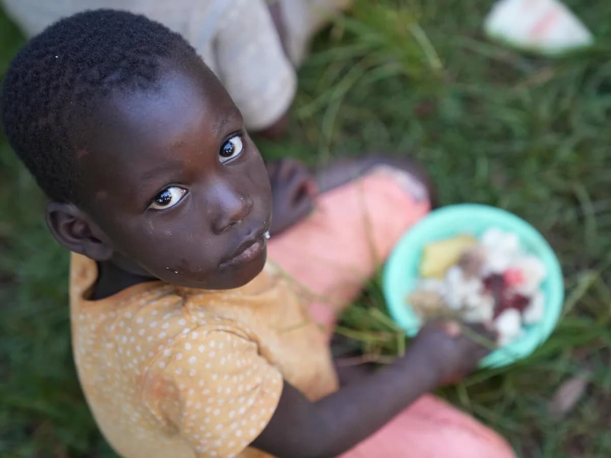 A child holding a plate of food