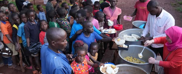 Children receiving nutritious food through orphan care