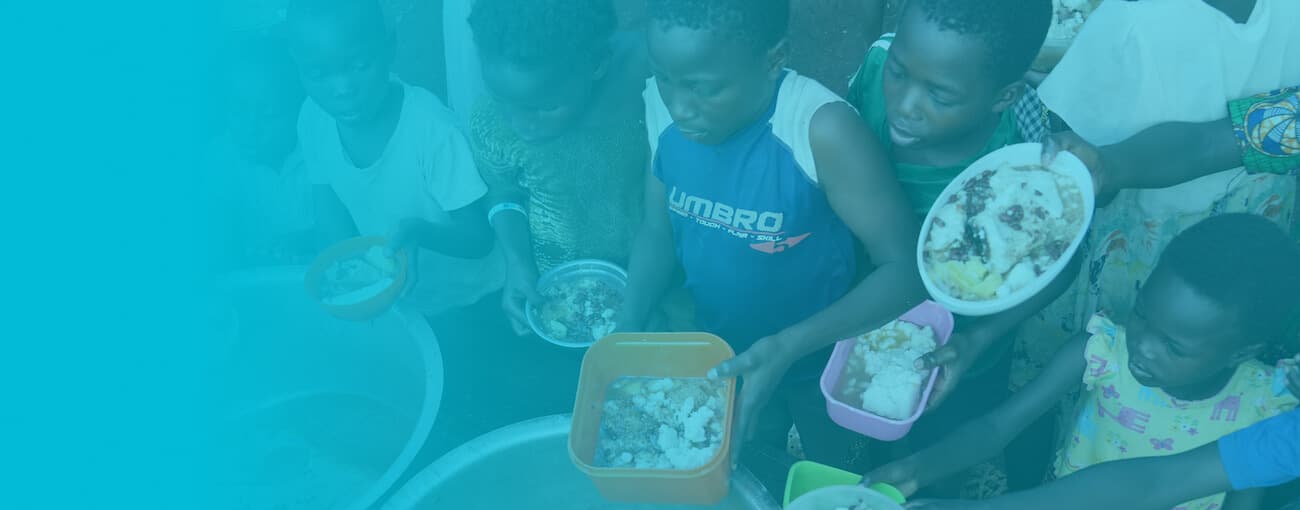 Children receiving meals through Embrace Relief