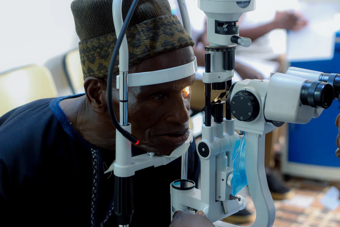 A patient receiving an eye examination at an Embrace Relief clinic