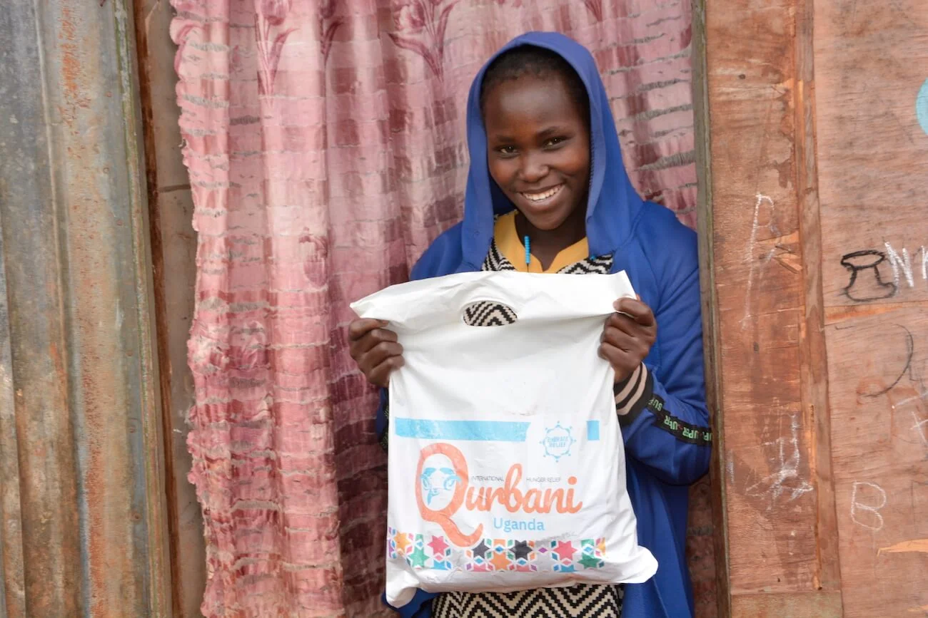 Family receiving Qurbani meat packages