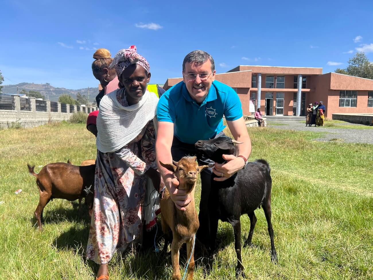 Woman caring for livestock as part of the SEED program training