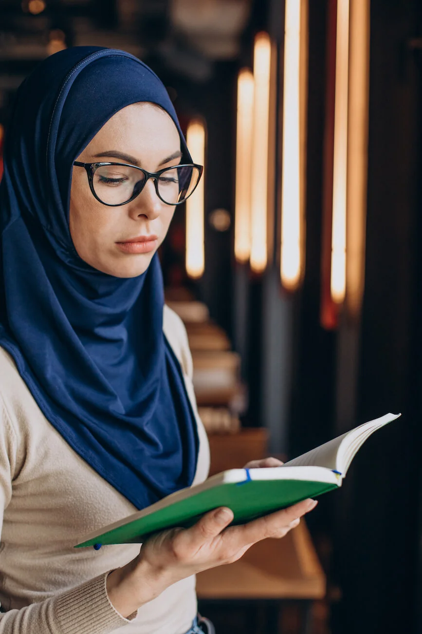 Woman praying during Ramadan, representing faith and resilience in Afghan education