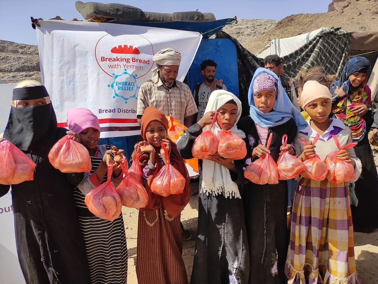 Yemeni women and children in a rural community setting