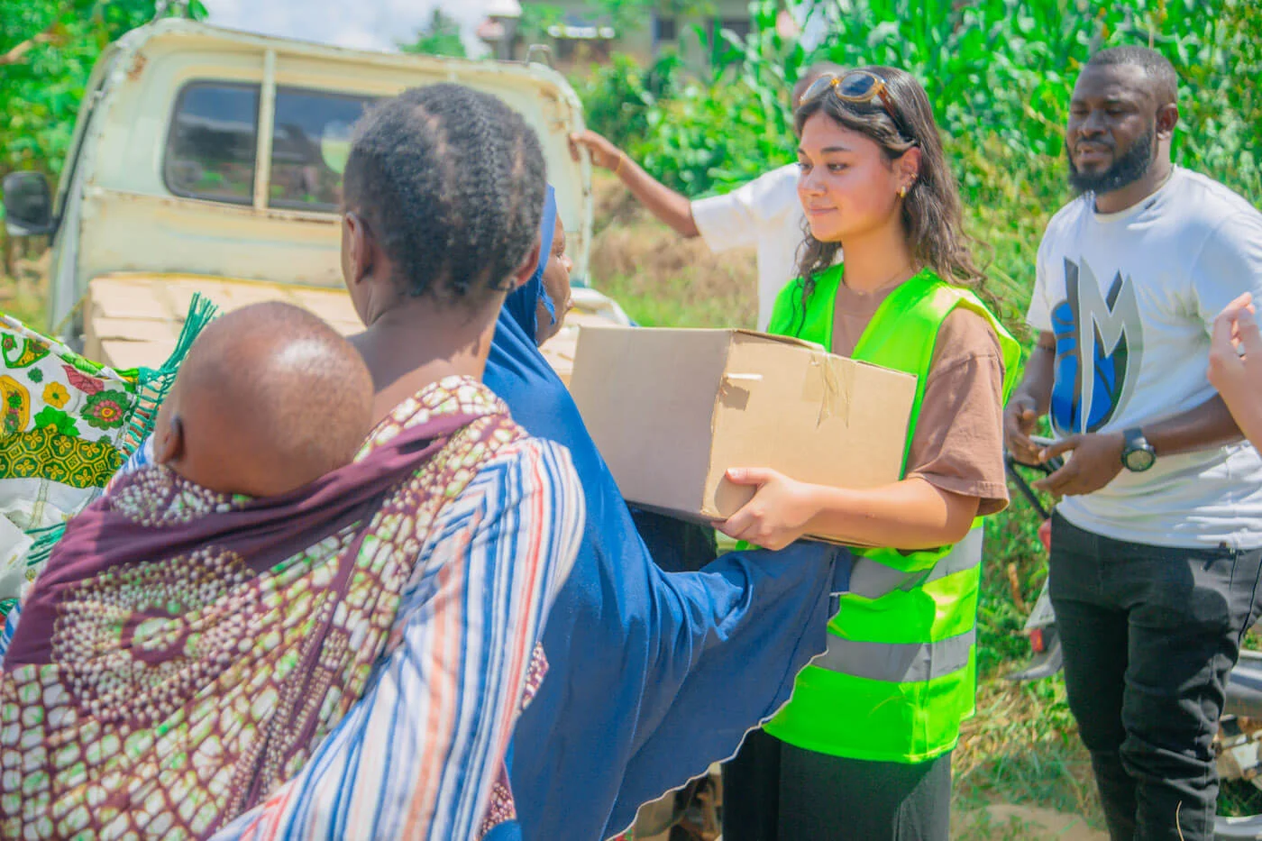 NOICA Youth members interacting with local women in a Tanzanian village