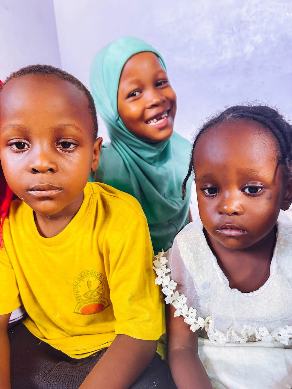 Children playing safely in a stable home environment provided by orphan care programs