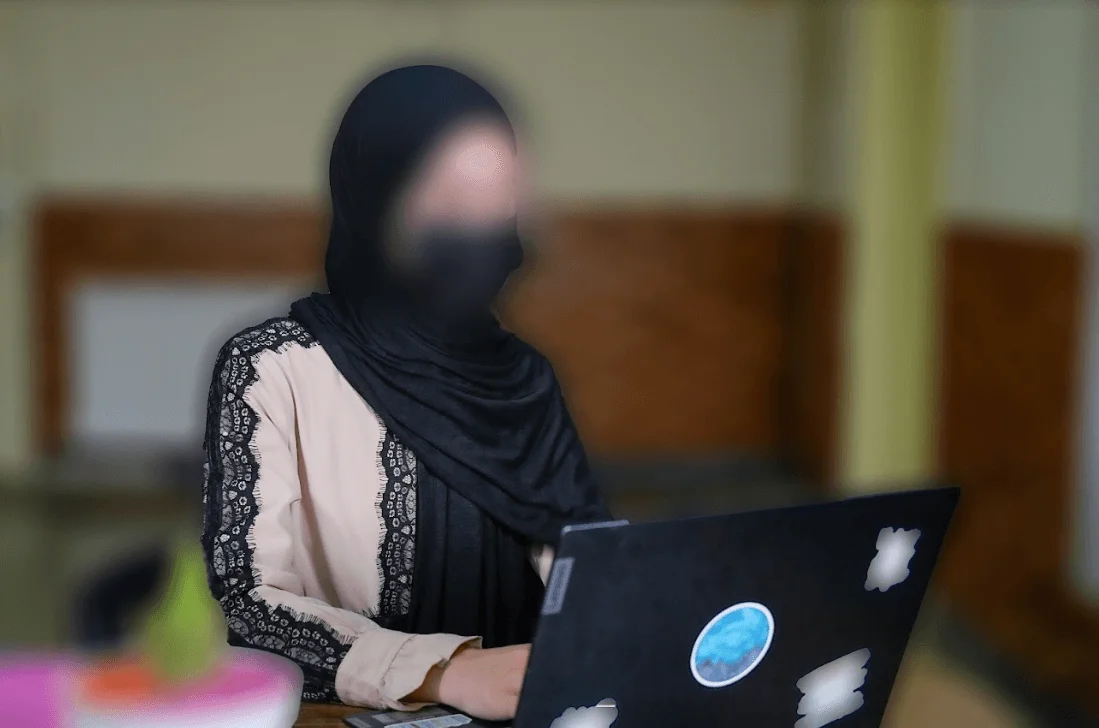 Student engaged in e-learning on a laptop