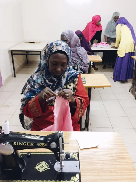 Women participating in Embrace Relief's KEEN sewing program in Kenya