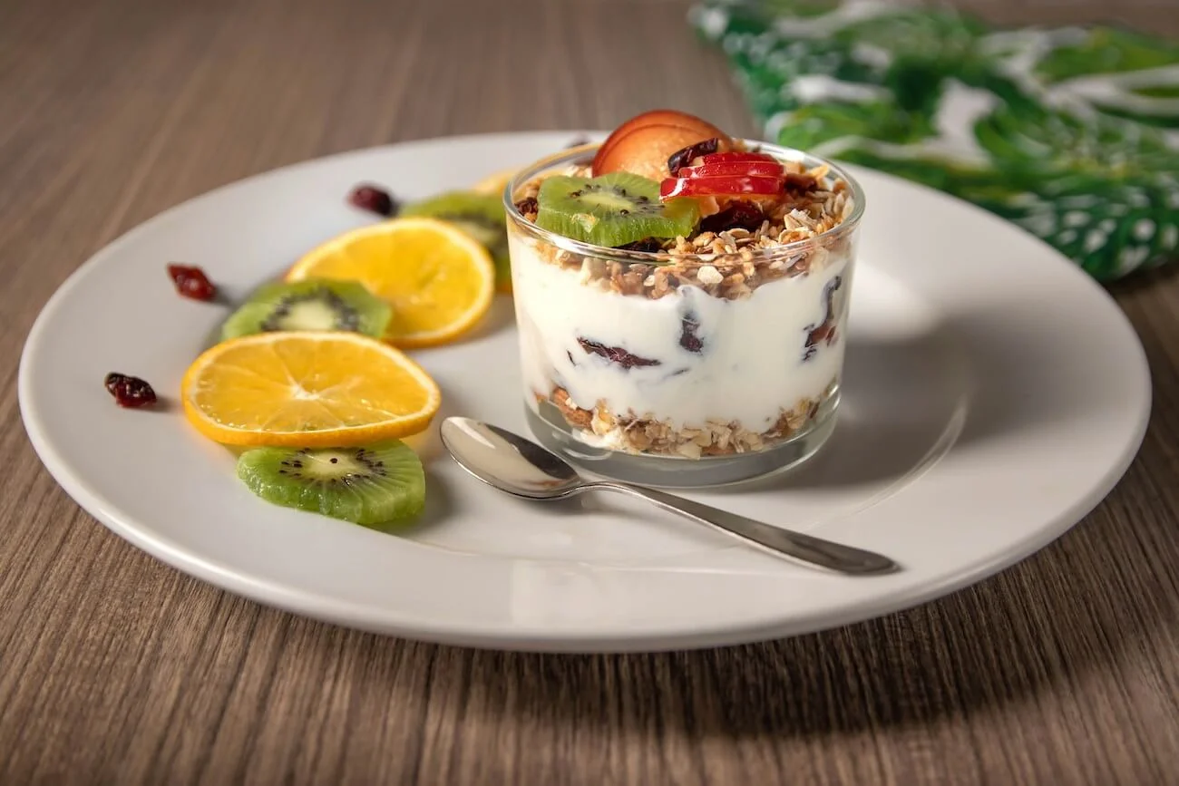 Colorful and nutritious lunch options for children including fruits and yogurt