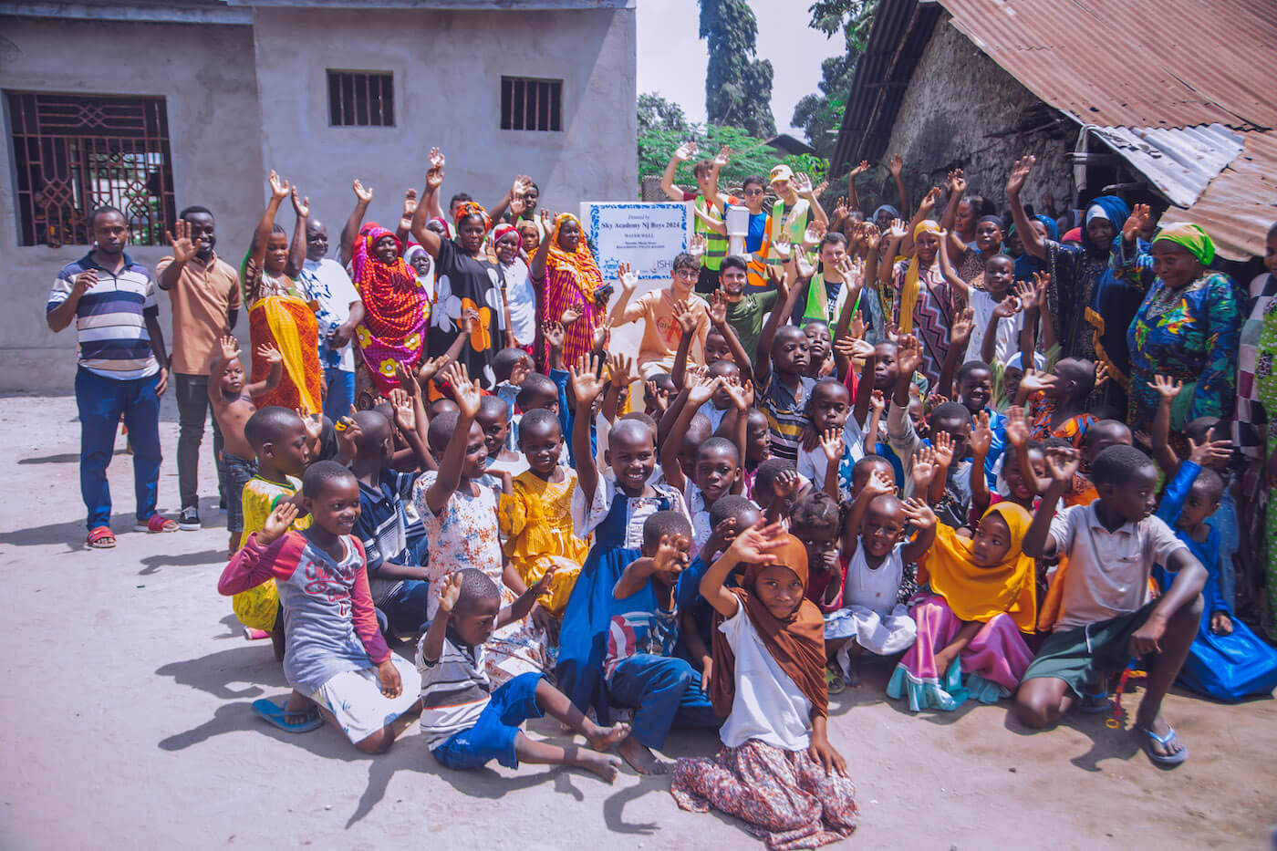 Group fundraising participants engaging with community members abroad