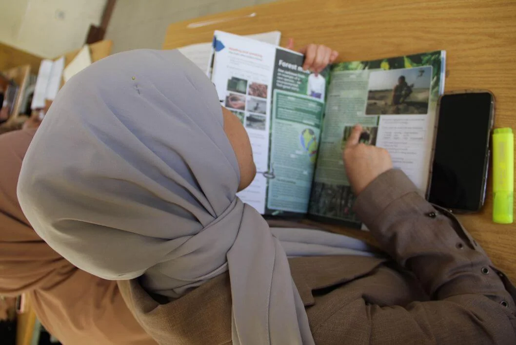 Young woman studying online in a remote region