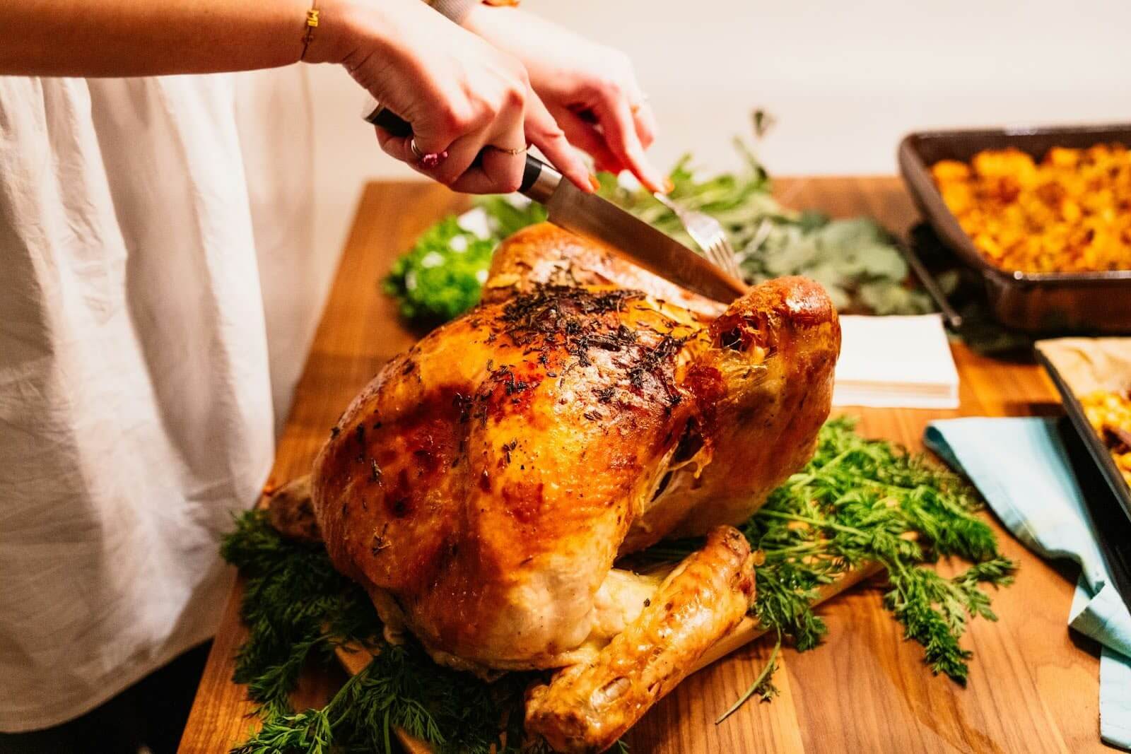 Raw turkey prepared with herbs and lemon for roasting