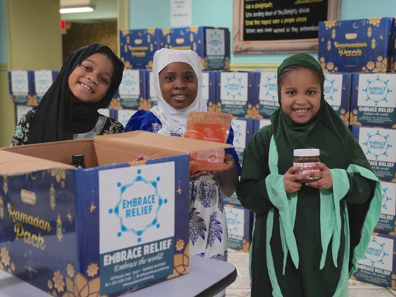Volunteers distributing food packages during Embrace Relief Ramadan campaign