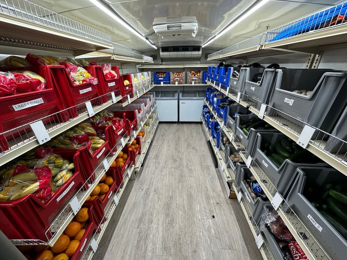 Mobile Farmers Market bus distributing supplies