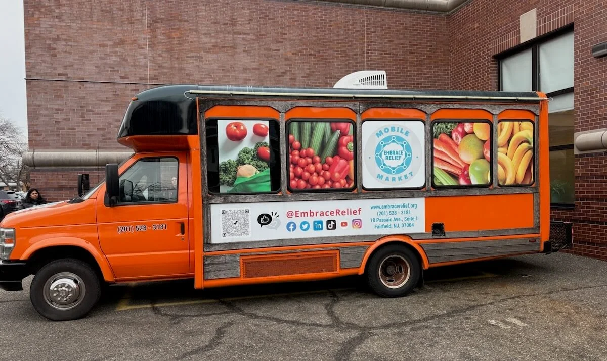 Embrace Relief Mobile Farmers Market distributing fresh produce to community members