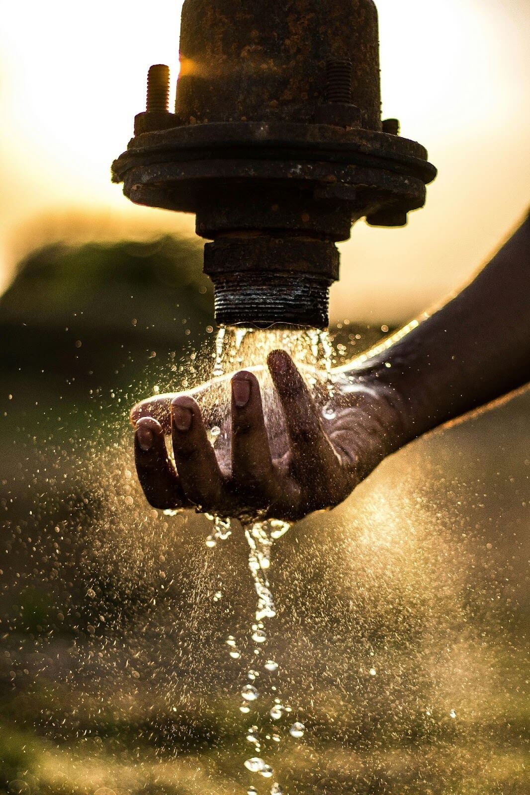 Woman collecting water in a rural community