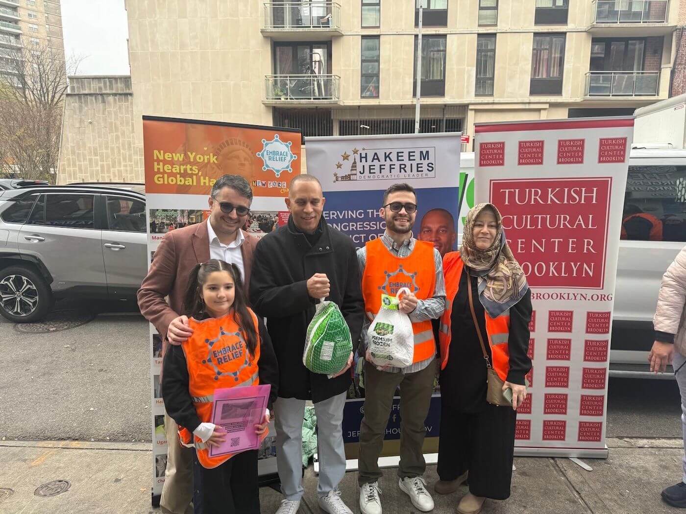 Volunteers distributing turkeys to families during Turkey Drive 2025