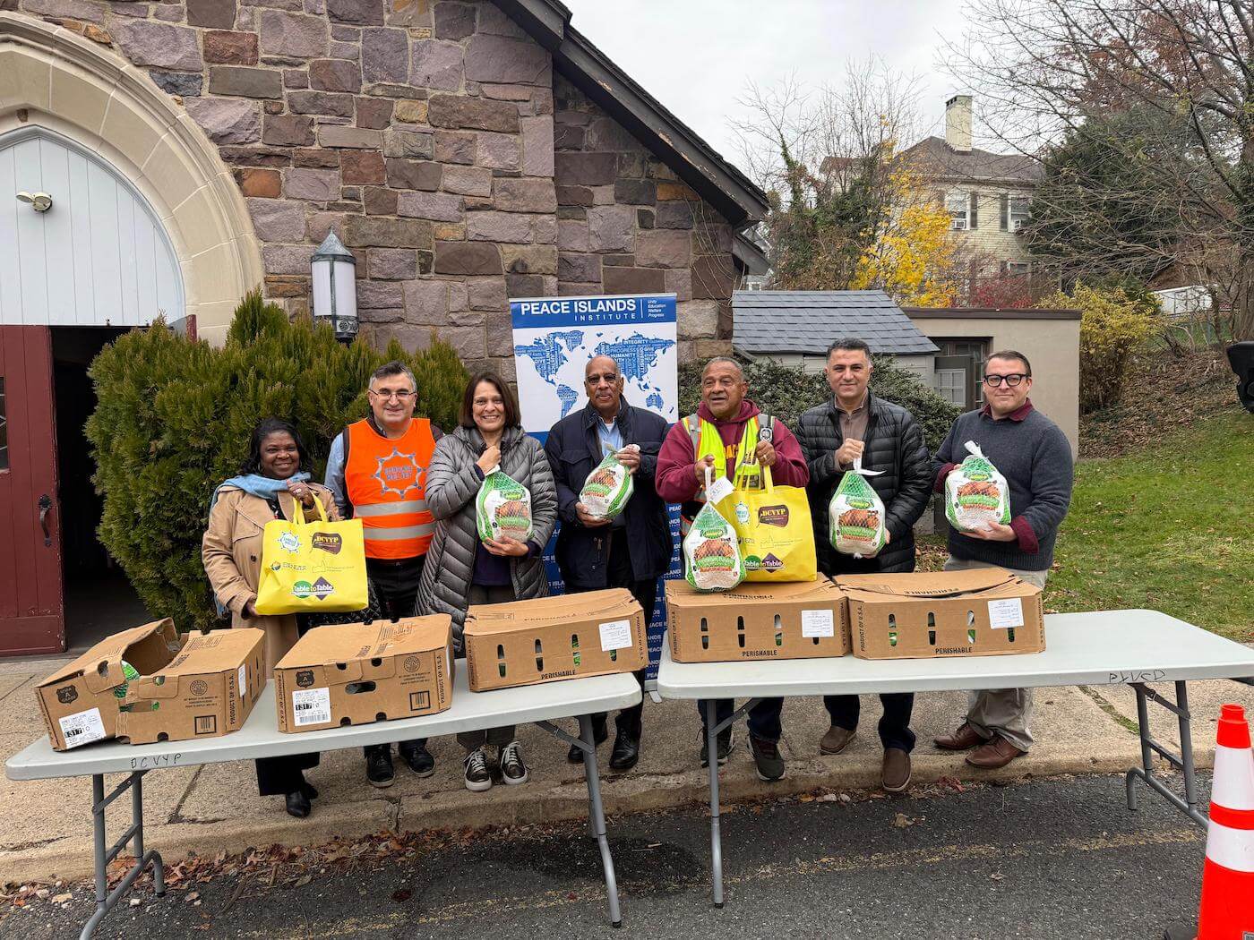 Embrace USA staff organizing turkey distribution event