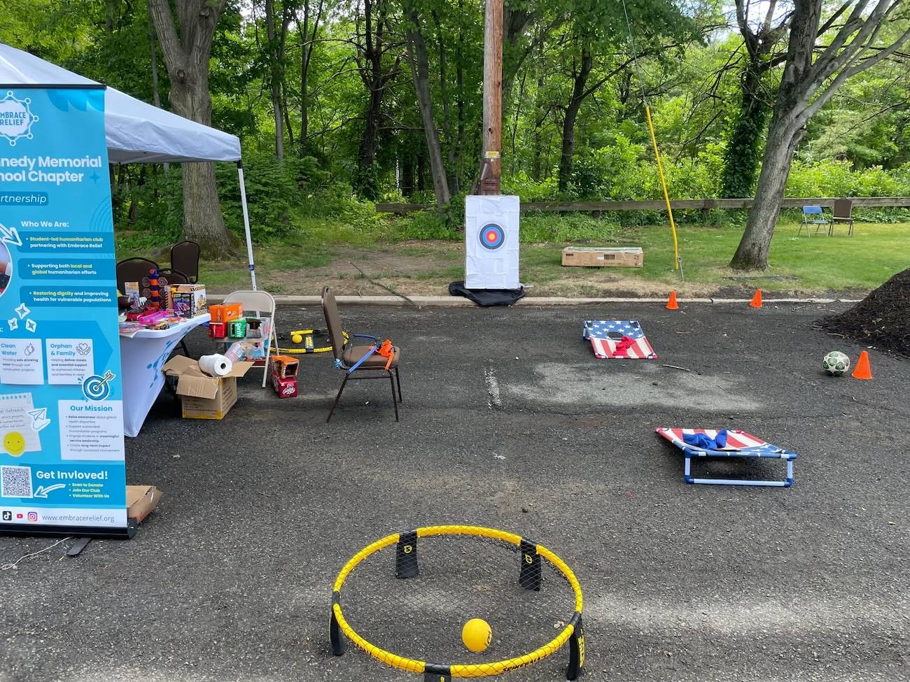 Students managing an interactive arcade booth at the festival