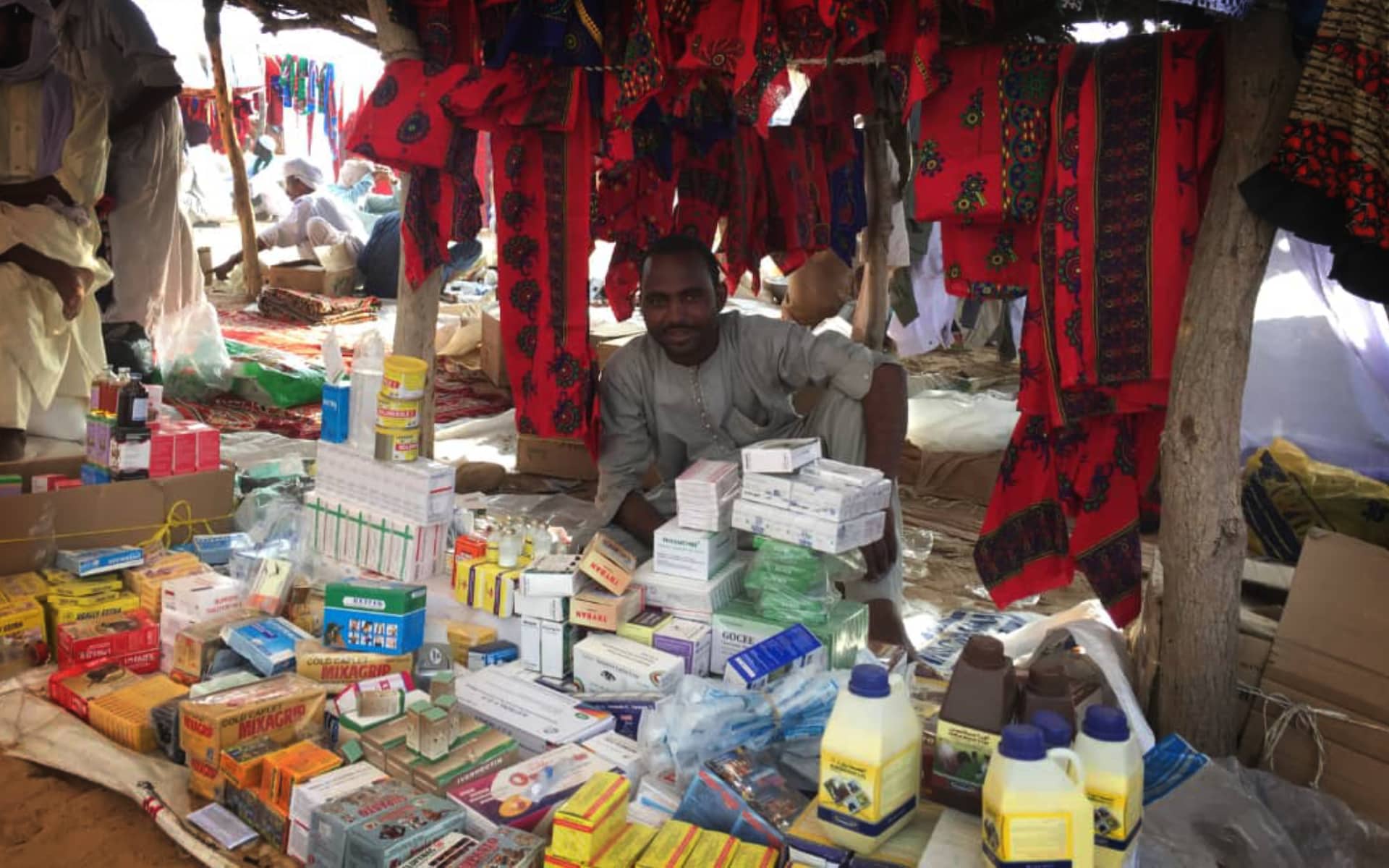 Village marketplace in Chad with stalls selling goods