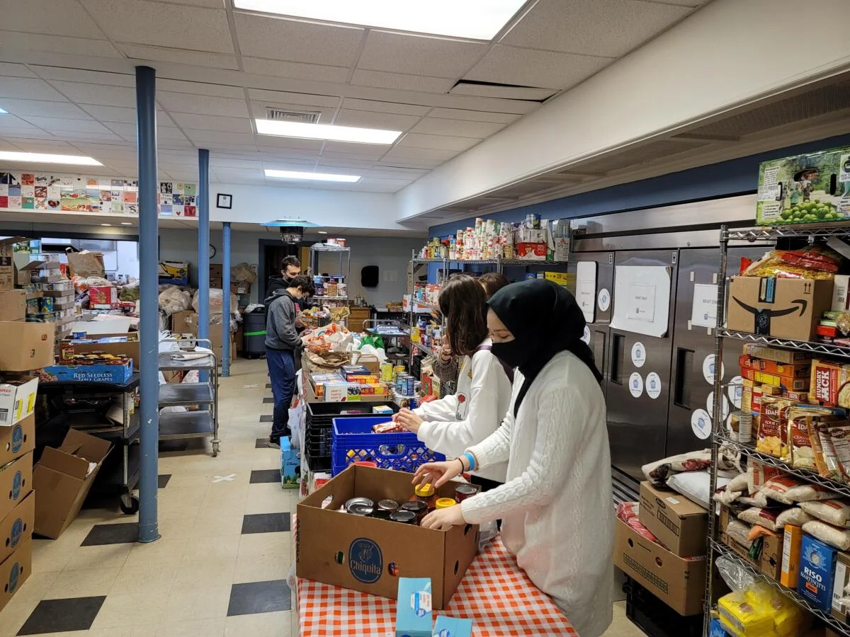 Students sorting food items for distribution