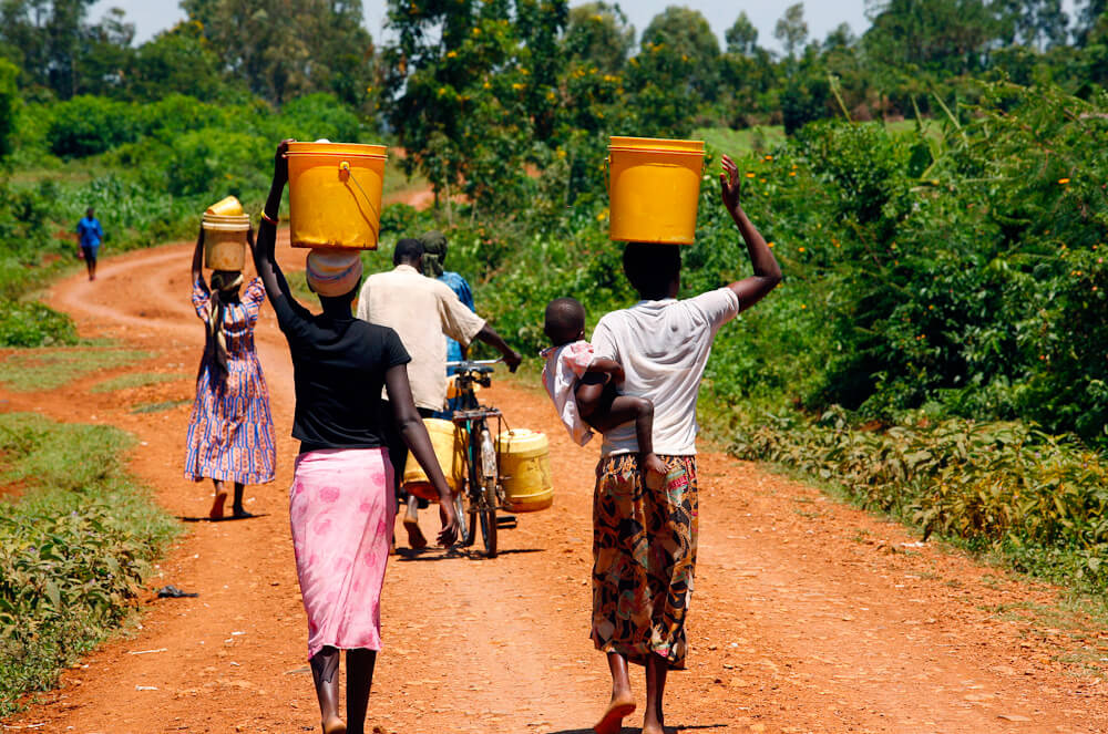 Community member accessing clean water from a well in sub-Saharan Africa