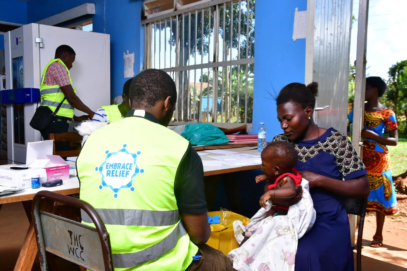 Medical staff attending to patients at a free health camp in Jinja, Uganda