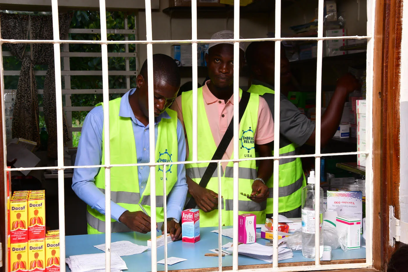 Doctors examining patients and providing medical consultations at the Jinja health camp