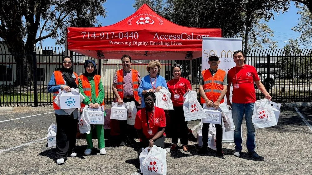 Volunteers and recipients during Qurbani distribution