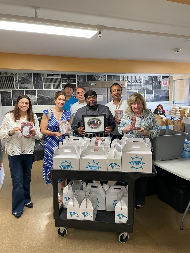 Volunteers distributing meat packages to families in New Jersey
